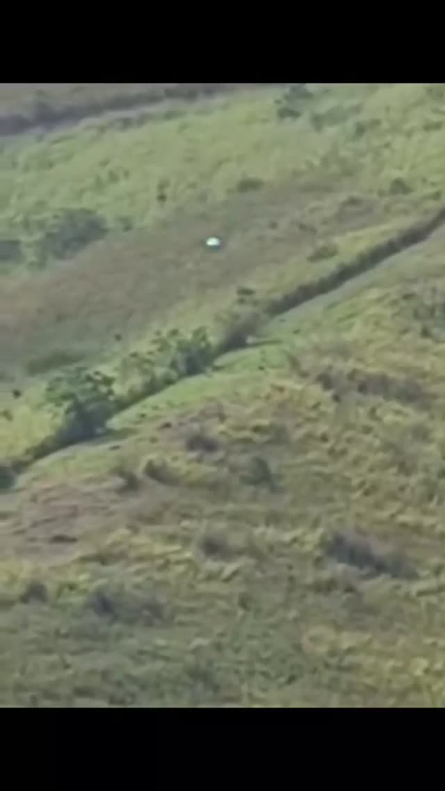 Orb With Sparkling Lights Flying Low Over A Mountainous Region In Colombia