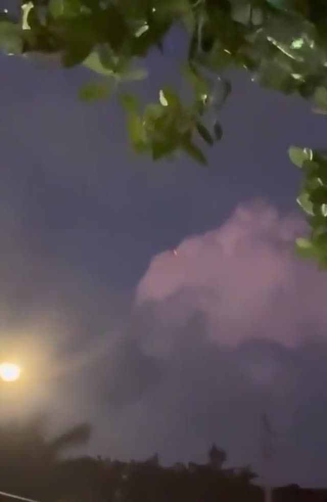 Red Orb Was Recorded Passing Through The Clouds By A Resident Of Boynton Beach FL